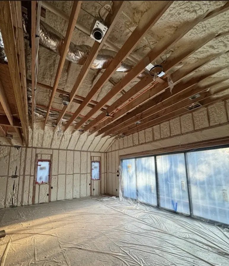 Interior walls and ceiling insulated with spray foam during new construction in South Salt Lake